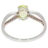 Back view of a Green Peridot 14K White Gold Ring showcasing the gemstone setting and intricate band design.